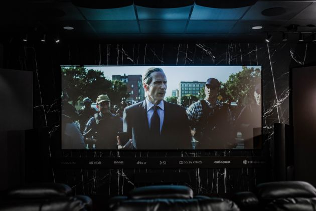 Home theater projection screen with movie scene