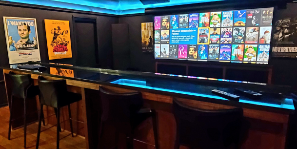 Home theater bar with LED lighting and movie display