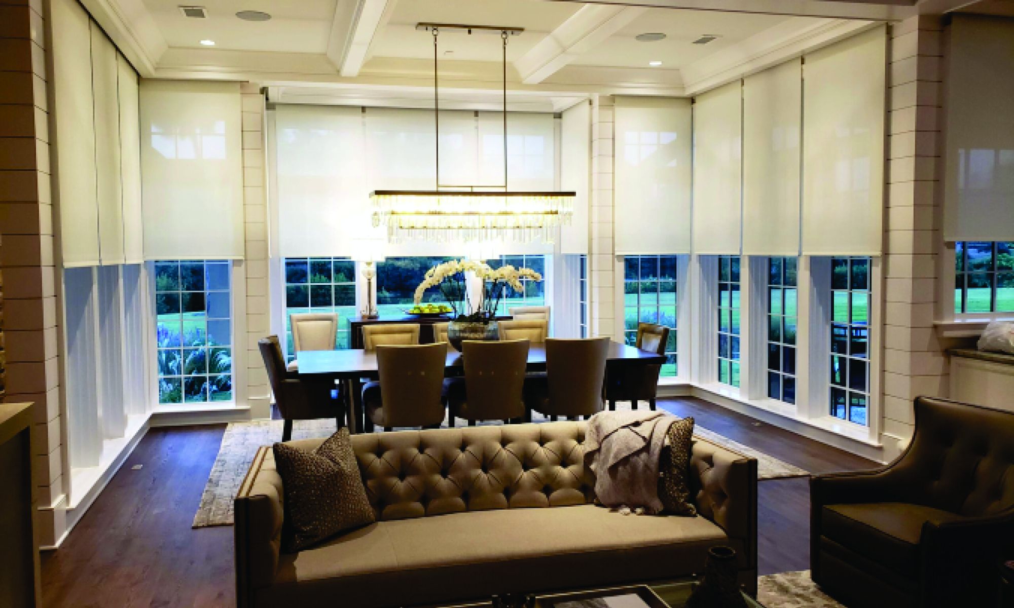 Elegant dining room with large windows and modern lighting