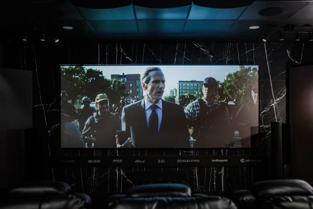 Home theater projection screen with movie scene